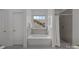 Well-appointed bathroom with a shower, tub, and neutral tile at 8441 Sandowne Ln, Huntersville, NC 28078