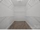Walk-in closet offering plenty of storage space and wire shelving at 8441 Sandowne Ln, Huntersville, NC 28078