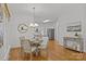 Inviting dining area showcasing hardwood floors and decorative lighting fixtures at 8441 Sandowne Ln, Huntersville, NC 28078