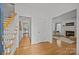 Bright foyer with hardwood floors and staircase leading to the second floor at 8441 Sandowne Ln, Huntersville, NC 28078