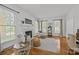 Spacious living room with a fireplace, multiple windows and hardwood flooring at 8441 Sandowne Ln, Huntersville, NC 28078