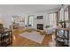 Cozy living room features a fireplace, hardwood floors, and elegant decor at 8441 Sandowne Ln, Huntersville, NC 28078
