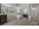 Serene main bedroom with neutral tones, carpet flooring, and natural light from the windows at 8441 Sandowne Ln, Huntersville, NC 28078