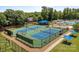 Aerial view of community tennis courts featuring well-maintained courts, shade structures, and manicured landscaping at 8441 Sandowne Ln, Huntersville, NC 28078