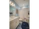 Bathroom with a vanity, tiled floors and a shower/tub with decorative shower curtain at 9002 Fair Oak Dr, Sherrills Ford, NC 28673