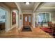 Open foyer with hardwood floors, arched doorways and trim, and a stained wood front door at 9002 Fair Oak Dr, Sherrills Ford, NC 28673