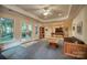 Spacious game room with a tray ceiling, doors to the backyard and a billiards table at 9002 Fair Oak Dr, Sherrills Ford, NC 28673