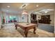 Spacious game room features a pool table, window seating and wet bar for entertaining at 9002 Fair Oak Dr, Sherrills Ford, NC 28673