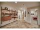 Hallway with built-in shelving, a neutral color scheme, and access to a carpeted bedroom at 9002 Fair Oak Dr, Sherrills Ford, NC 28673