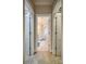 Hallway view of the bathroom featuring tile floors, a glass shower, and access to the walk-in closet at 9002 Fair Oak Dr, Sherrills Ford, NC 28673