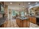 Well-appointed kitchen with granite countertops, custom cabinets, and a breakfast nook with ample natural light at 9002 Fair Oak Dr, Sherrills Ford, NC 28673