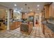 Gourmet kitchen with granite countertops, custom cabinets, and stainless steel appliances at 9002 Fair Oak Dr, Sherrills Ford, NC 28673