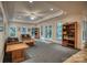 Cozy living room with a tray ceiling, built-in bookshelves, and access to a patio at 9002 Fair Oak Dr, Sherrills Ford, NC 28673