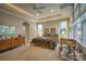 Spacious main bedroom with a decorative ceiling, ceiling fan and large windows that let in plenty of natural light at 9002 Fair Oak Dr, Sherrills Ford, NC 28673