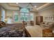 Large main bedroom with a sitting area, spacious windows and a decorative tray ceiling at 9002 Fair Oak Dr, Sherrills Ford, NC 28673
