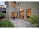 A stone patio with outdoor seating offers a tranquil backyard retreat at 9002 Fair Oak Dr, Sherrills Ford, NC 28673