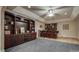 Wet bar area with dark wood cabinets and seating, perfect for entertaining guests at 9002 Fair Oak Dr, Sherrills Ford, NC 28673