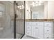 Bathroom featuring a glass shower door, updated fixtures, a granite countertop and modern vanity with ample storage at 9104 Kingsmead Ln, Waxhaw, NC 28173