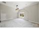 Bonus bedroom with vaulted ceiling, a cozy carpet, and a large window to let the light in at 9104 Kingsmead Ln, Waxhaw, NC 28173