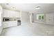 Large bonus room with wet bar and mini fridge, carpet floors, and lots of storage at 9104 Kingsmead Ln, Waxhaw, NC 28173