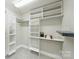 Walk-in closet with custom shelving and ample storage space offers organization and convenience at 9104 Kingsmead Ln, Waxhaw, NC 28173