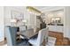 Elegant dining room with a stunning chandelier, hardwood floors, and stylish furnishings at 9104 Kingsmead Ln, Waxhaw, NC 28173