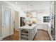 Bright, open kitchen with a large island, modern appliances, and stylish pendant lighting at 9104 Kingsmead Ln, Waxhaw, NC 28173