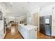 Modern kitchen features island, stainless appliances, and an open layout at 9104 Kingsmead Ln, Waxhaw, NC 28173