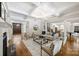 Spacious living room features a coffered ceiling, hardwood floors, and an open layout at 9104 Kingsmead Ln, Waxhaw, NC 28173