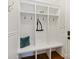 Convenient mudroom with built-in storage, hooks, and a bench for easy organization at 9104 Kingsmead Ln, Waxhaw, NC 28173