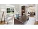 Bright office with large windows, stylish decor, and a view of the front yard at 9104 Kingsmead Ln, Waxhaw, NC 28173
