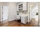 Home office has built in desk and storage with hardwood floors at 9104 Kingsmead Ln, Waxhaw, NC 28173