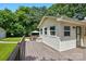 Inviting back deck perfect for outdoor relaxation, with lush greenery in the background and a small shed at 103 W Sunset Dr, Locust, NC 28097