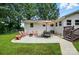Relaxing backyard patio area with outdoor furniture, perfect for entertaining guests at 103 W Sunset Dr, Locust, NC 28097