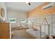 Cozy bedroom features a playful design, with wainscotting and a unique house frame bed and mini hammock at 103 W Sunset Dr, Locust, NC 28097