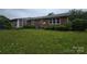 The backyard is expansive and green, perfect for outdoor activities and entertaining at 116 E Graves St, Candor, NC 27229