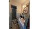 A bathroom with blue tile and linoleum flooring at 116 E Graves St, Candor, NC 27229