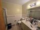 A bathroom with white tile at 116 E Graves St, Candor, NC 27229