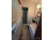 A bathroom with blue tile and linoleum flooring at 116 E Graves St, Candor, NC 27229
