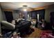 A messy bedroom with hard wood flooring at 116 E Graves St, Candor, NC 27229
