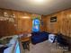 A bedroom with paneled walls at 116 E Graves St, Candor, NC 27229