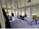 Bright sunroom with multiple windows, allowing natural light to flood the space at 116 E Graves St, Candor, NC 27229