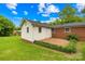 Quaint brick patio complemented by fresh landscaping, offering a cozy outdoor retreat at 119 Oak Ave, Shelby, NC 28152
