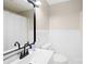 Clean bathroom featuring a white vanity with a black faucet, a shower with a white curtain, and a modern mirror at 119 Oak Ave, Shelby, NC 28152