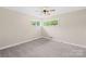 Inviting bedroom with soft carpet, a ceiling fan, and two windows that offer a comfortable and relaxing atmosphere at 119 Oak Ave, Shelby, NC 28152