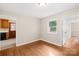 Bright bedroom with hardwood floors, a window, and neutral walls, creating a serene and comfortable living space at 119 Oak Ave, Shelby, NC 28152