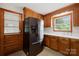 Functional kitchen with wooden cabinets, white countertops, and stainless steel appliances, adjacent to an exterior door at 119 Oak Ave, Shelby, NC 28152