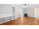 Inviting living room featuring hardwood floors, a decorative fireplace, built-in shelving, and ample natural light at 119 Oak Ave, Shelby, NC 28152