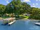 Stunning aerial view of waterfront home, large pier and blue water at 138 Lakefront Dr, Mooresville, NC 28117