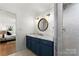 Modern bathroom features custom vanity, ship lap walls, and a marble tiled shower and flooring at 138 Lakefront Dr, Mooresville, NC 28117